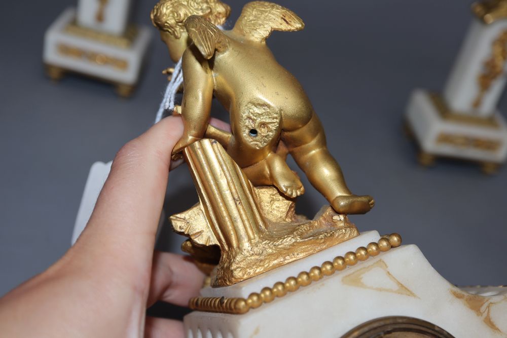 A 19th century ormolu clock garniture, with angelic surmount